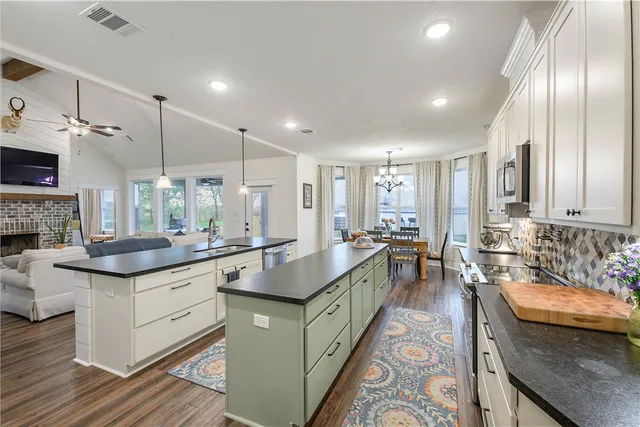 a view of a swimming pool with a table and chairs