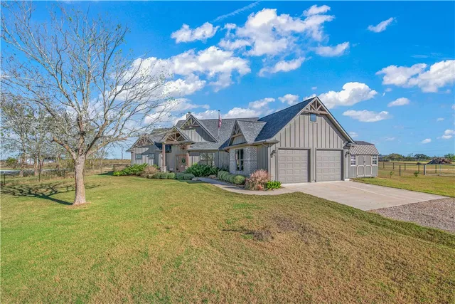 a view of large house with a yard