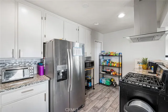 a view of a hallway with washer and dryer
