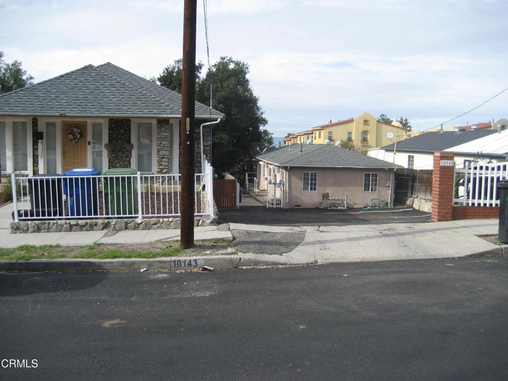 10145 Mountair Avenue Los Angeles, CA 91042 - Photo 2 of 2 a house view with a garden