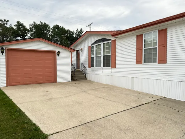 a front view of a house with a garage