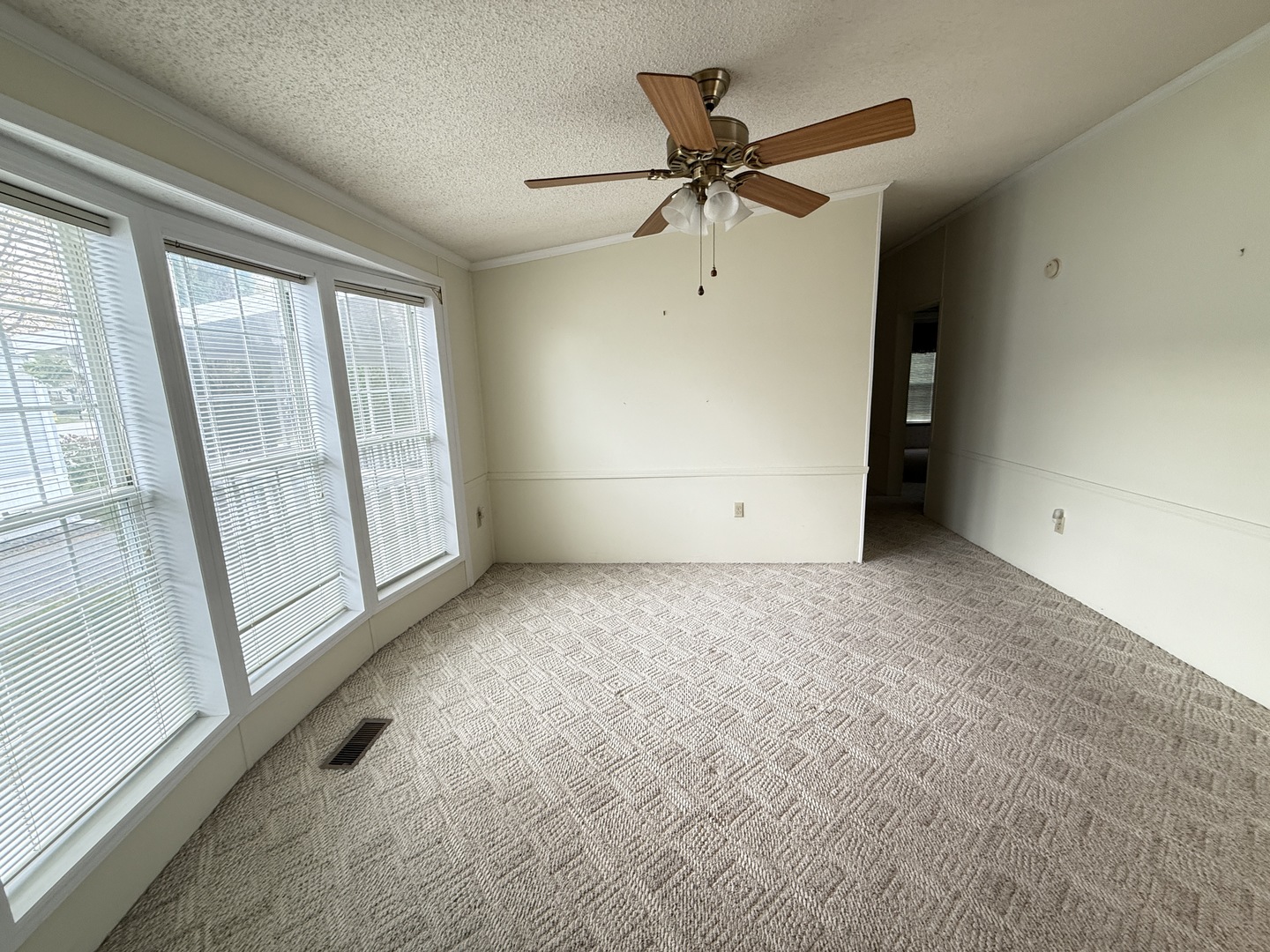 35 Partridge Lane Beecher, IL 60401 - Photo 24 of 34 a view of a livingroom with a ceiling fan and window