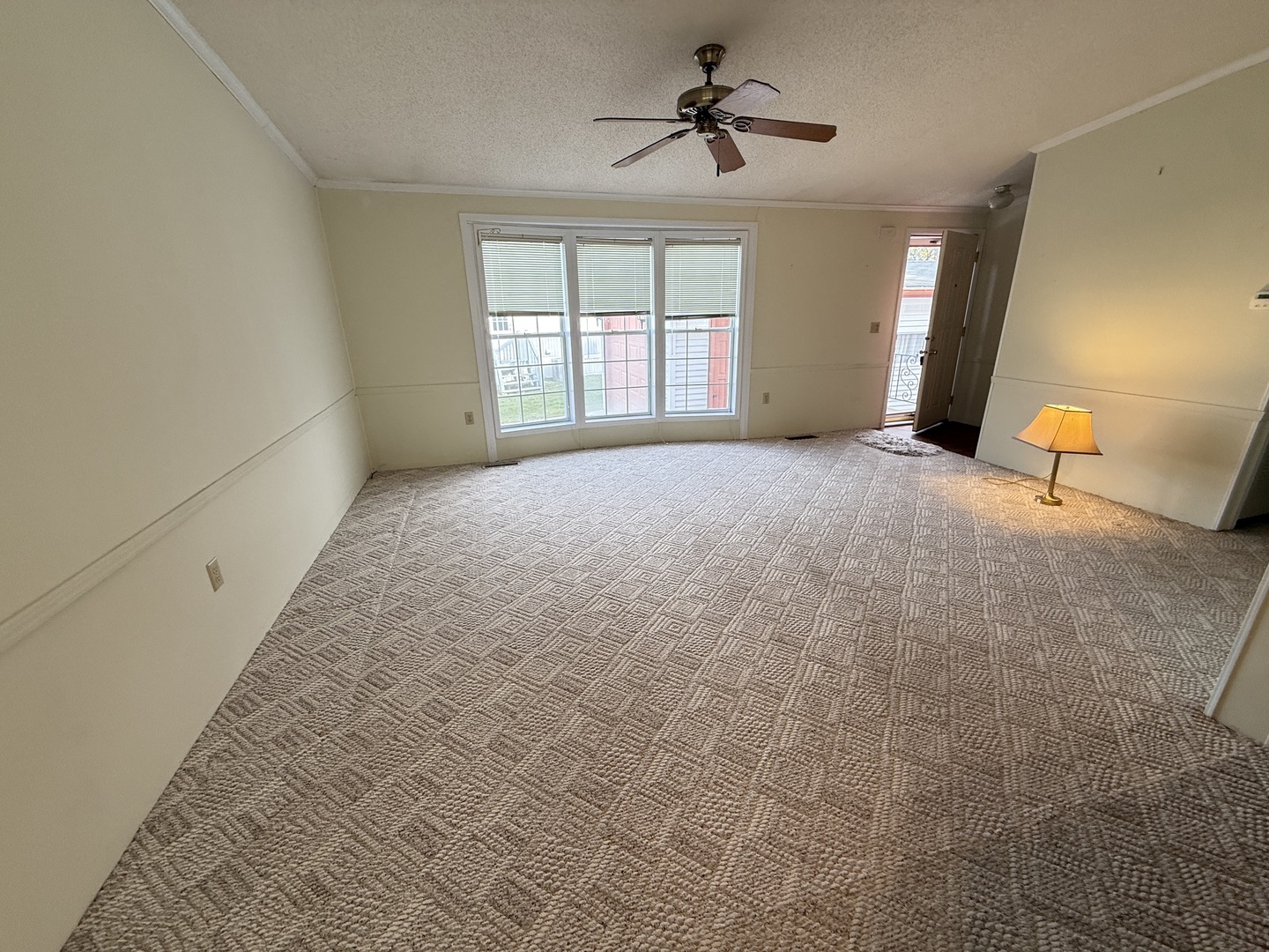 35 Partridge Lane Beecher, IL 60401 - Photo 31 of 34 a big room with windows and a chandelier fan