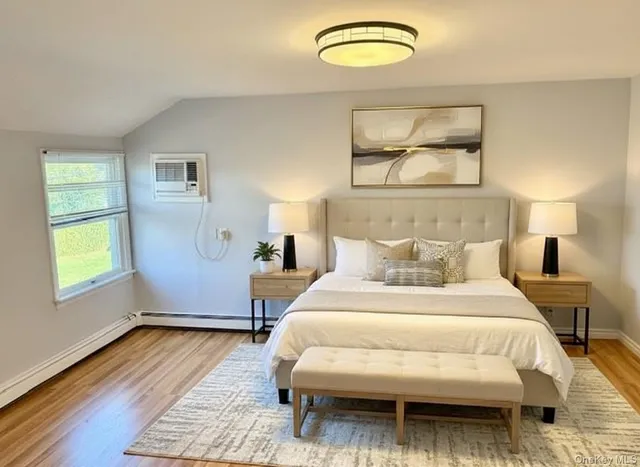 a bedroom with a bed and window