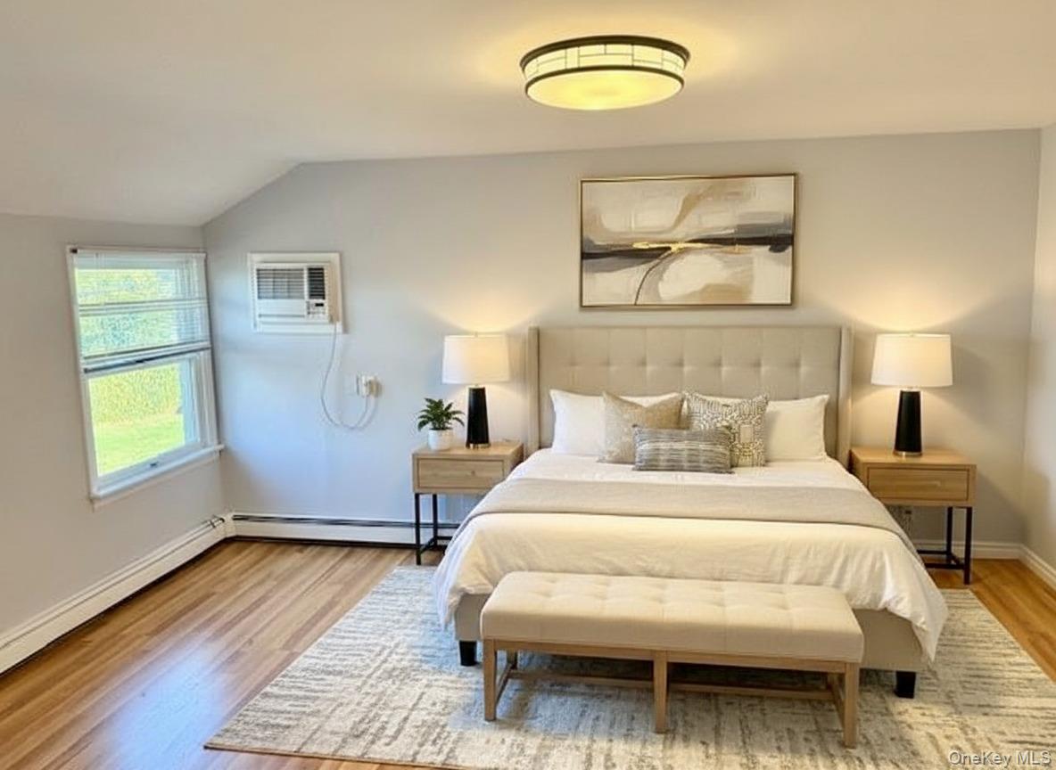 10 Revere Road Port Washington, NY 11050 - Photo 13 of 17 a bedroom with a bed and window