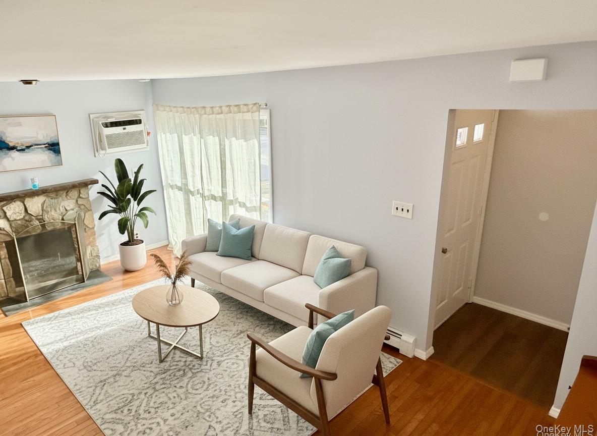 10 Revere Road Port Washington, NY 11050 - Photo 6 of 17 a living room with furniture and wooden floor