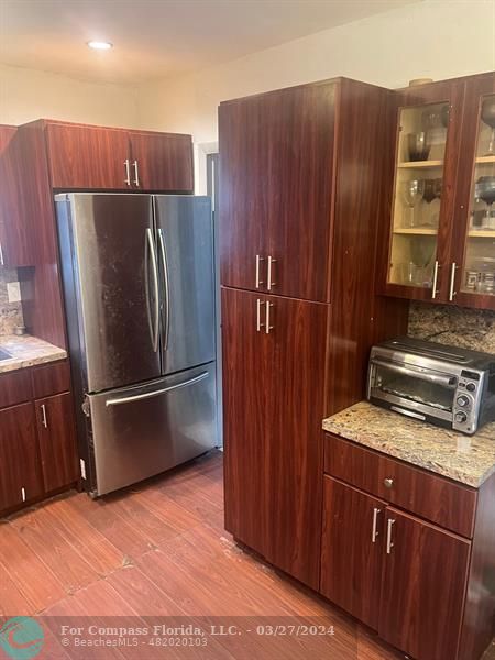 281 Northwest 52nd Street Miami, FL 33127 - Photo 13 of 28 a kitchen with stainless steel appliances granite countertop a refrigerator and a sink
