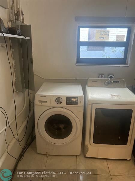 281 Northwest 52nd Street Miami, FL 33127 - Photo 16 of 28 a utility room with dryer and washer