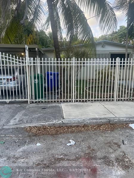 281 Northwest 52nd Street Miami, FL 33127 - Photo 2 of 28 a view of small yard with a fence