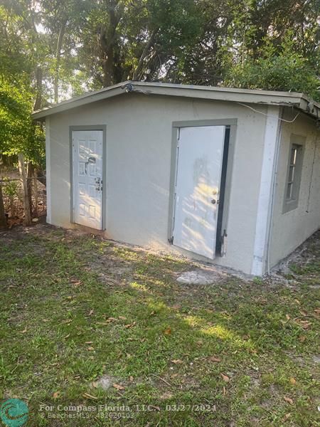 281 Northwest 52nd Street Miami, FL 33127 - Photo 22 of 28 a backyard of a house