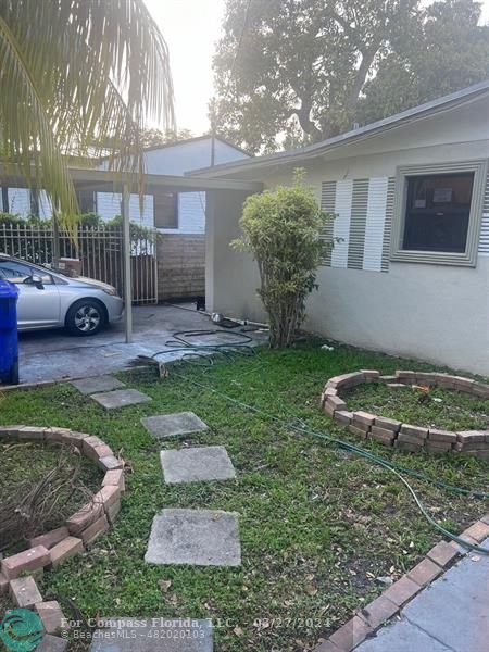 281 Northwest 52nd Street Miami, FL 33127 - Photo 6 of 28 a view of a backyard with a garden and plants