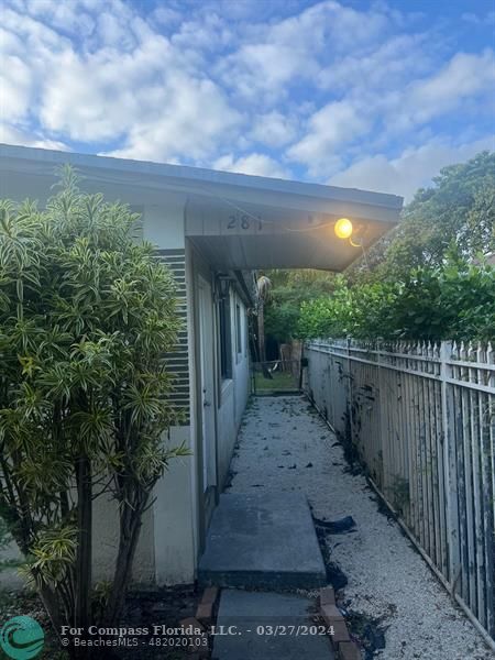 281 Northwest 52nd Street Miami, FL 33127 - Photo 9 of 28 a view of a pathway with a yard