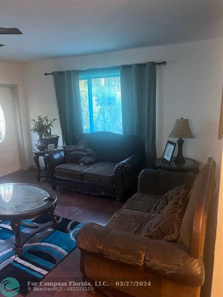 281 Northwest 52nd Street Miami, FL 33127 - Photo 10 of 28 a living room with furniture and a window