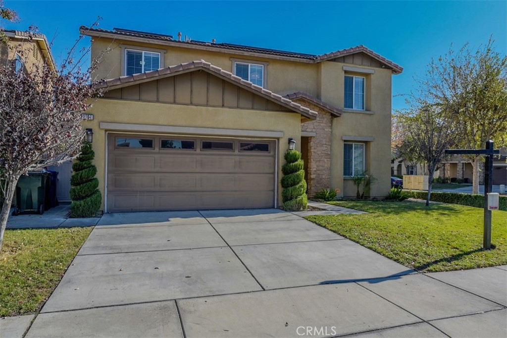 1101 North Yucca Avenue Rialto, CA 92376 - Photo 1 of 1 a front view of a house with a yard