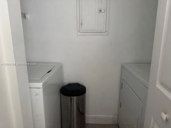 a bathroom with a shower and a sink