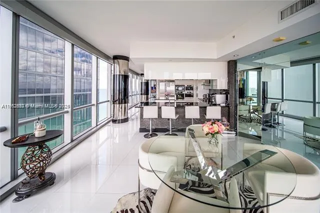 a kitchen with granite countertop a sink and stainless steel appliances