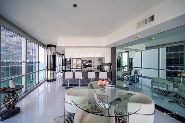 a swimming pool with outdoor seating and yard