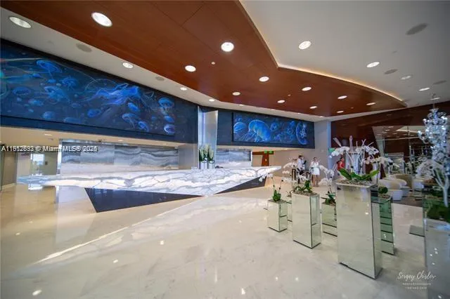 a view of a entrance gate of the house and trees