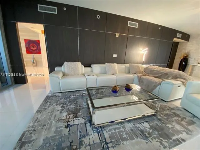 a bedroom with a bed and a mirror