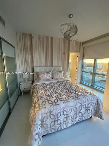 a bedroom with a bed and pillows
