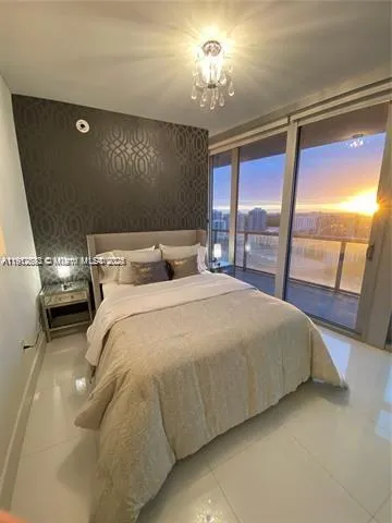 a living room with furniture a dining table and a large window