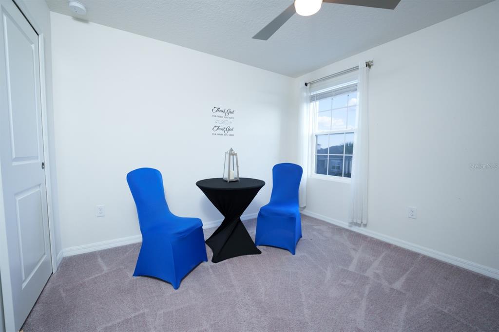 458 Hamlet Loop Davenport, FL 33837 - Photo 15 of 19 a view of a dining room with furniture and chandelier