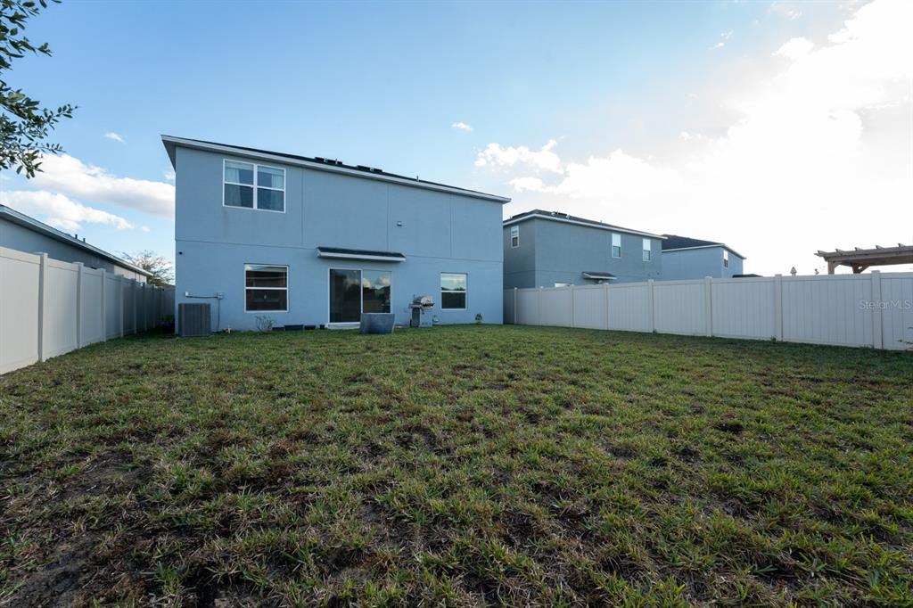 458 Hamlet Loop Davenport, FL 33837 - Photo 17 of 19 a house view with a garden space