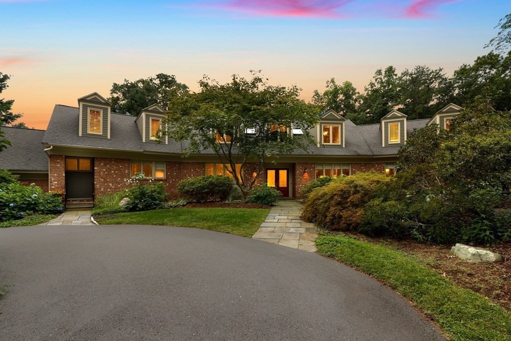37 Autumn Road Weston, MA 02493 - Photo 2 of 42 a front view of a house with a yard and shrubs