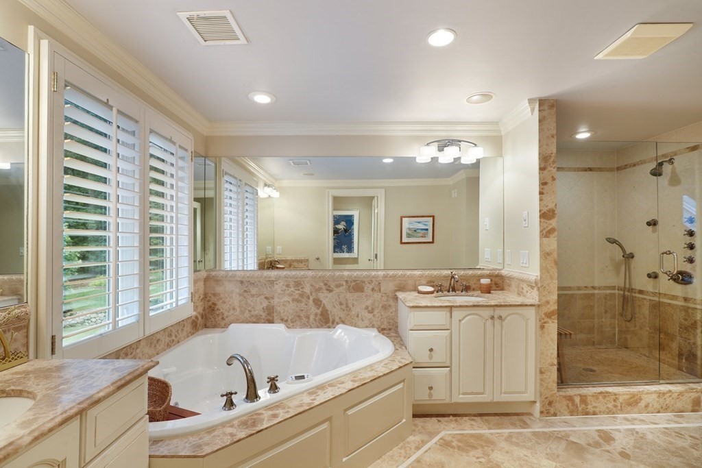 37 Autumn Road Weston, MA 02493 - Photo 21 of 42 a bathroom with a bathtub a sink a window and a shower