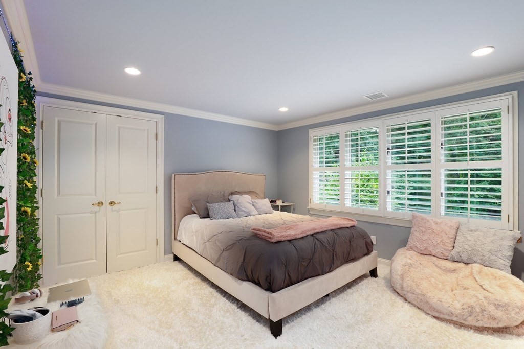 37 Autumn Road Weston, MA 02493 - Photo 27 of 42 a bedroom with a large bed and a large window