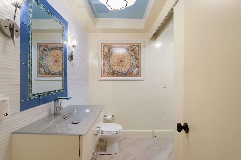 37 Autumn Road Weston, MA 02493 - Photo 38 of 42 a bathroom with a toilet sink and mirror