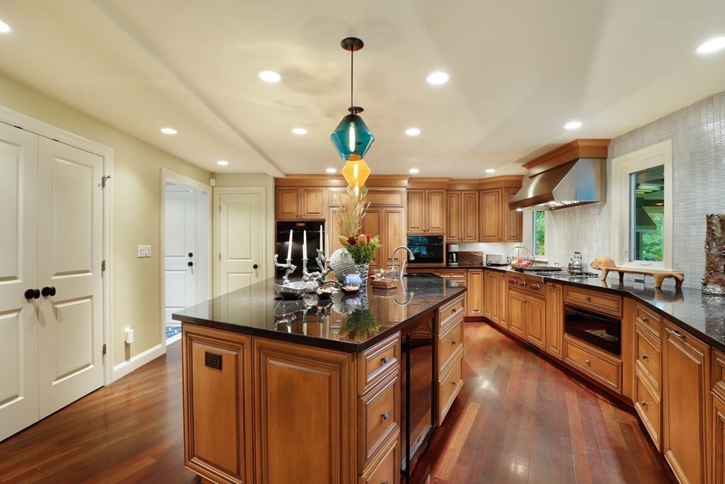 37 Autumn Road Weston, MA 02493 - Photo 5 of 42 a kitchen with counter top space a sink stainless steel appliances and cabinets