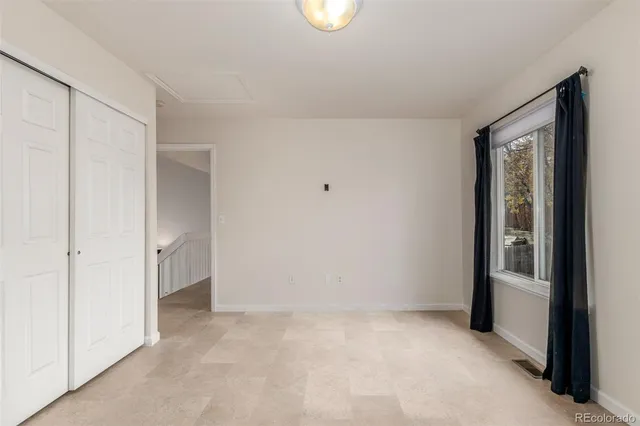 a view of an empty room and window