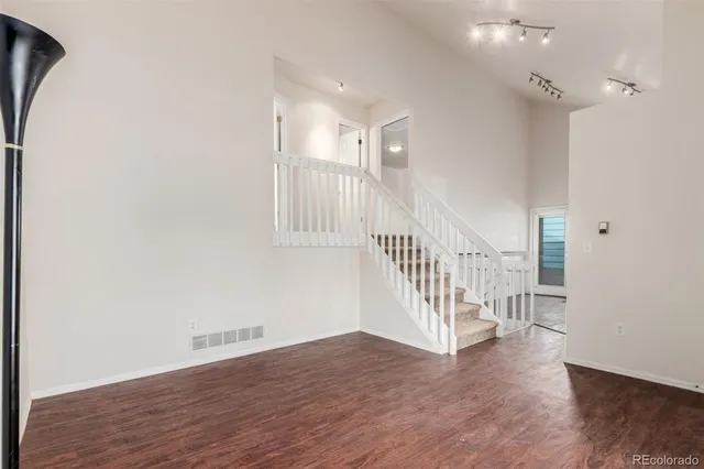 a view of entryway with wooden floor