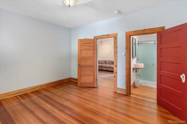 a view of livingroom with hardwood floor and a sink