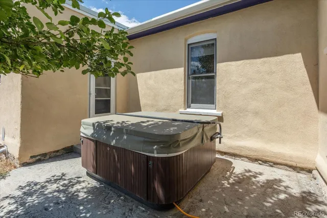 a bath room with a stove and a potted plant