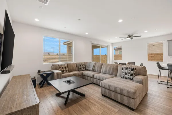 a view of a dining room with furniture and wooden floor