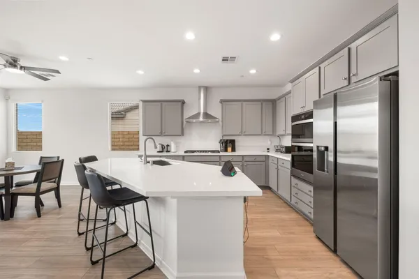 a kitchen with a sink and a large window