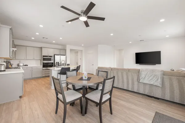 a bedroom with a bed and a television