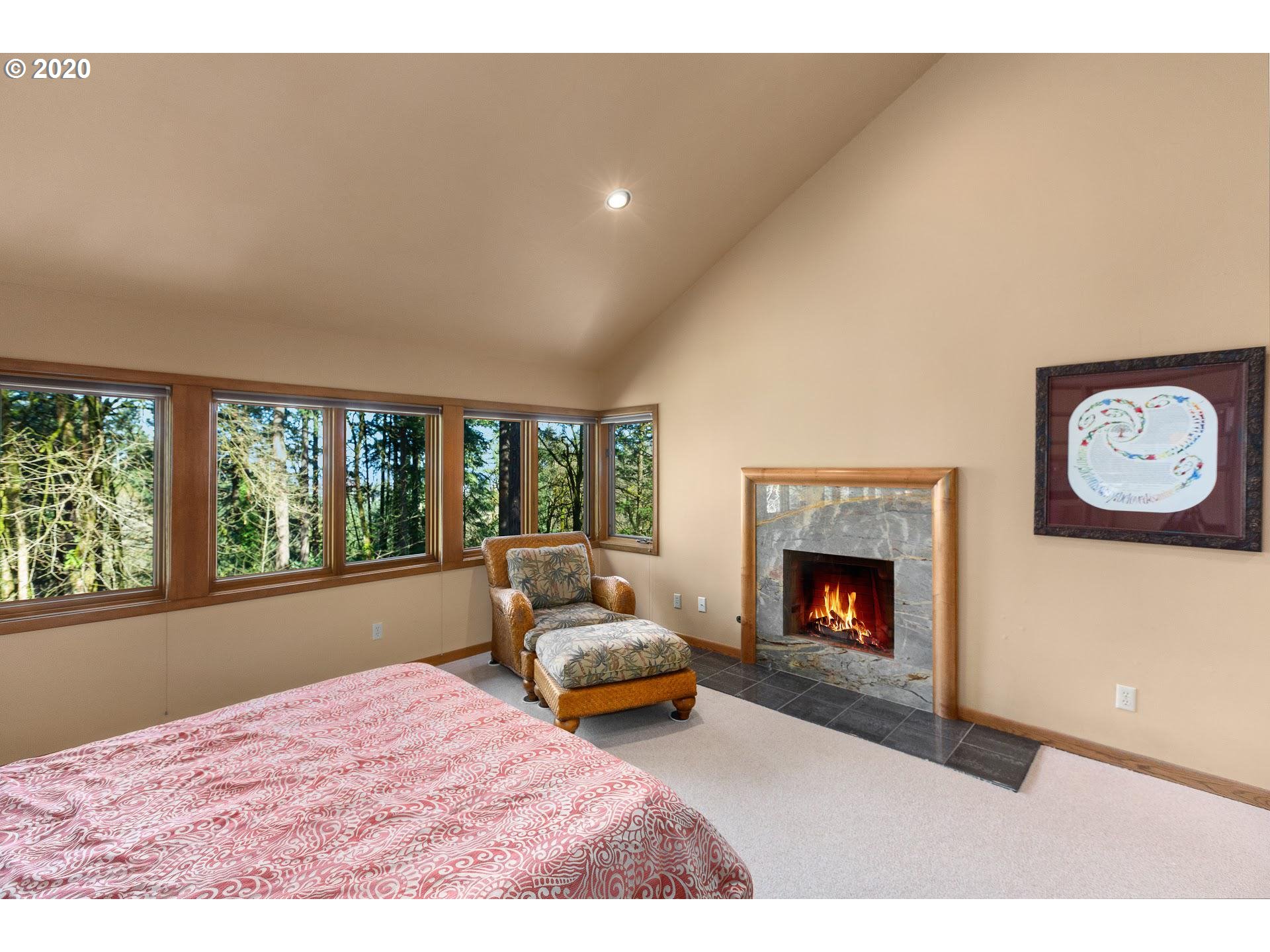 2654 Southwest Fairmount Boulevard Portland, OR 97239 - Photo 13 of 32 a living room with furniture and a fireplace