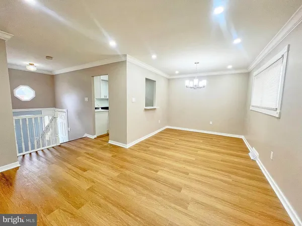 a kitchen with a refrigerator a sink and cabinets