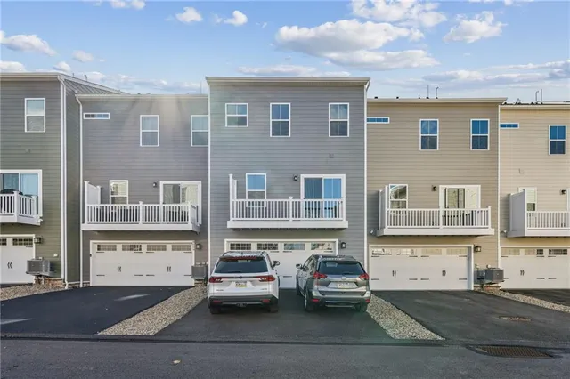 a view of a brick building next to a road