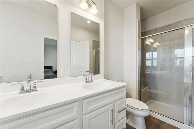 a bathroom with a tub a sink and mirror