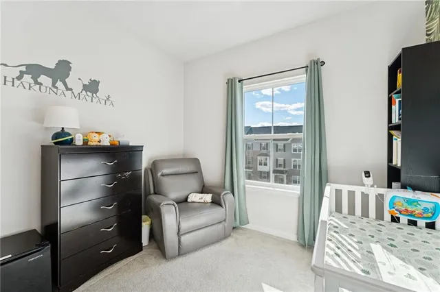 a room with a dresser and a mirror