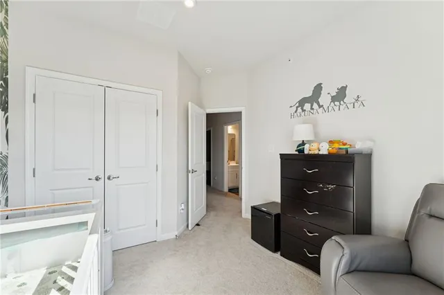 a view of a workspace with furniture and a bookshelf