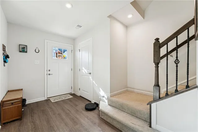a view of entryway with wooden floor