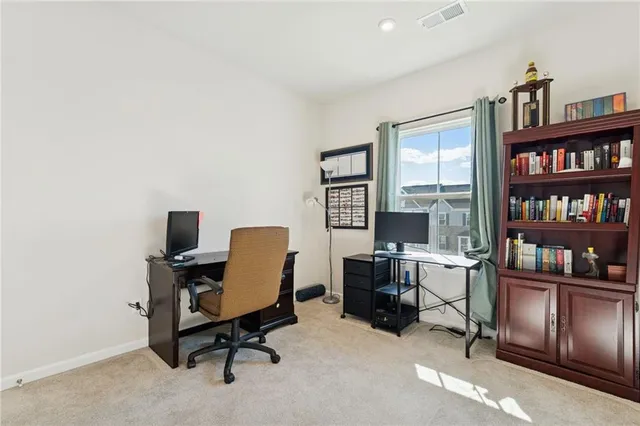 a view of a workspace with furniture