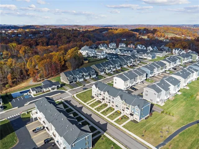 an aerial view of a house with a lake view