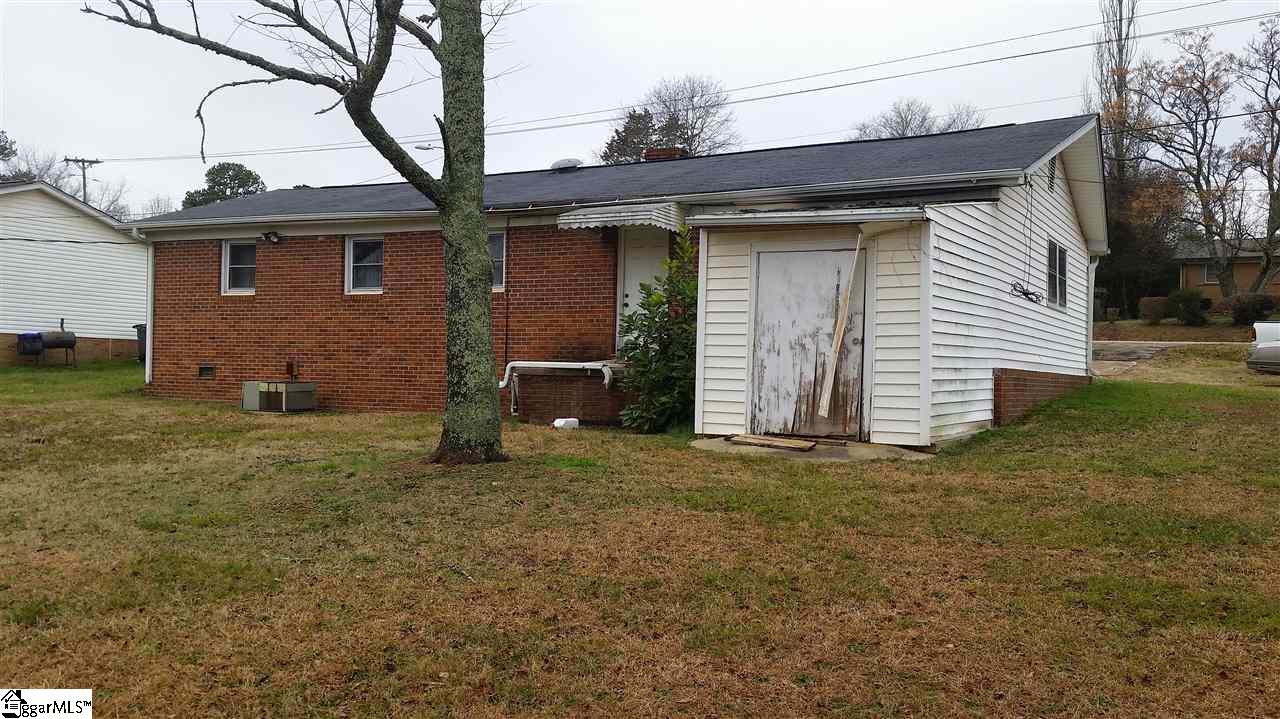 Left rear side of house behind garage