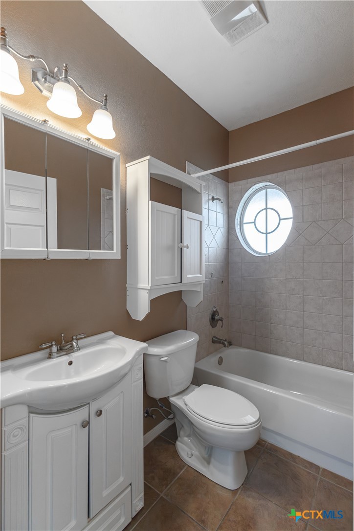 283 County Road 4710 Kempner, TX 76539 - Photo 34 of 47 a bathroom with a toilet sink and mirror